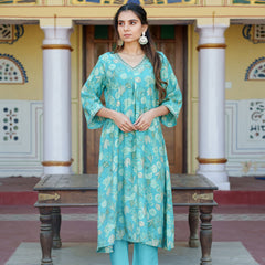 Women Muslin pleated kurta with bead work Neckline & Solid Bottom Set