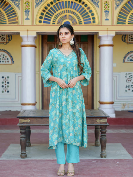 Women Muslin pleated kurta with bead work Neckline & Solid Bottom Set