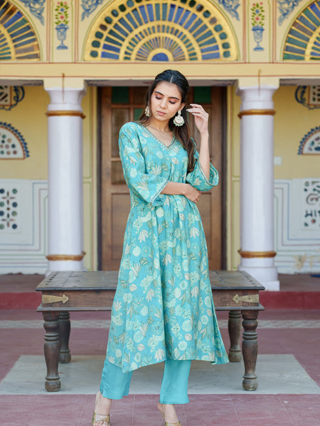 Women Muslin pleated kurta with bead work Neckline & Solid Bottom Set