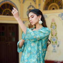 Women Muslin pleated kurta with bead work Neckline & Solid Bottom Set