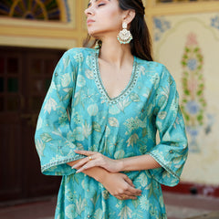 Women Muslin pleated kurta with bead work Neckline & Solid Bottom Set