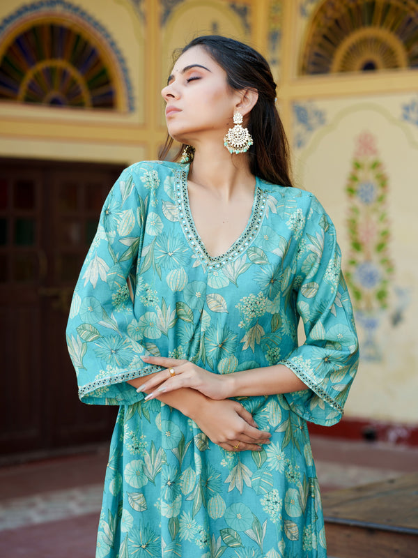 Women Muslin pleated kurta with bead work Neckline & Solid Bottom Set