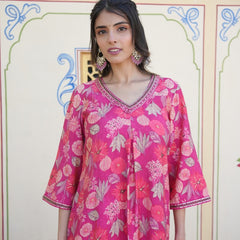 Women Muslin pleated kurta with bead work Neckline & Solid Bottom Set
