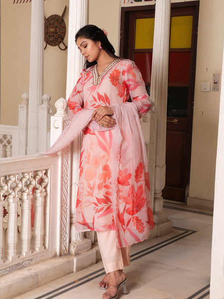 Peach Placement print collared Straight suit set with solid bottom & printed organza cut work dupatta set.