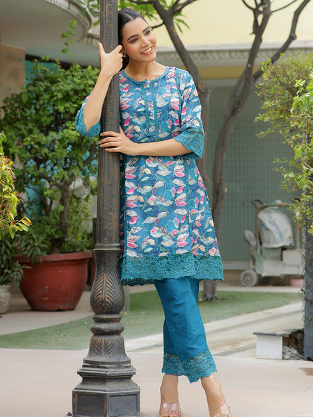 Women cyan embroidered printed  kurta set with laced solid pants