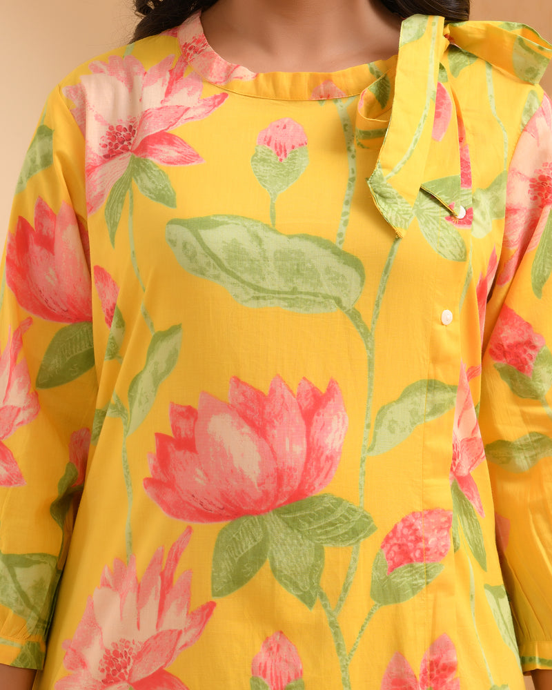 Yellow floral middie dress with shoulder tie-up and gathered panel